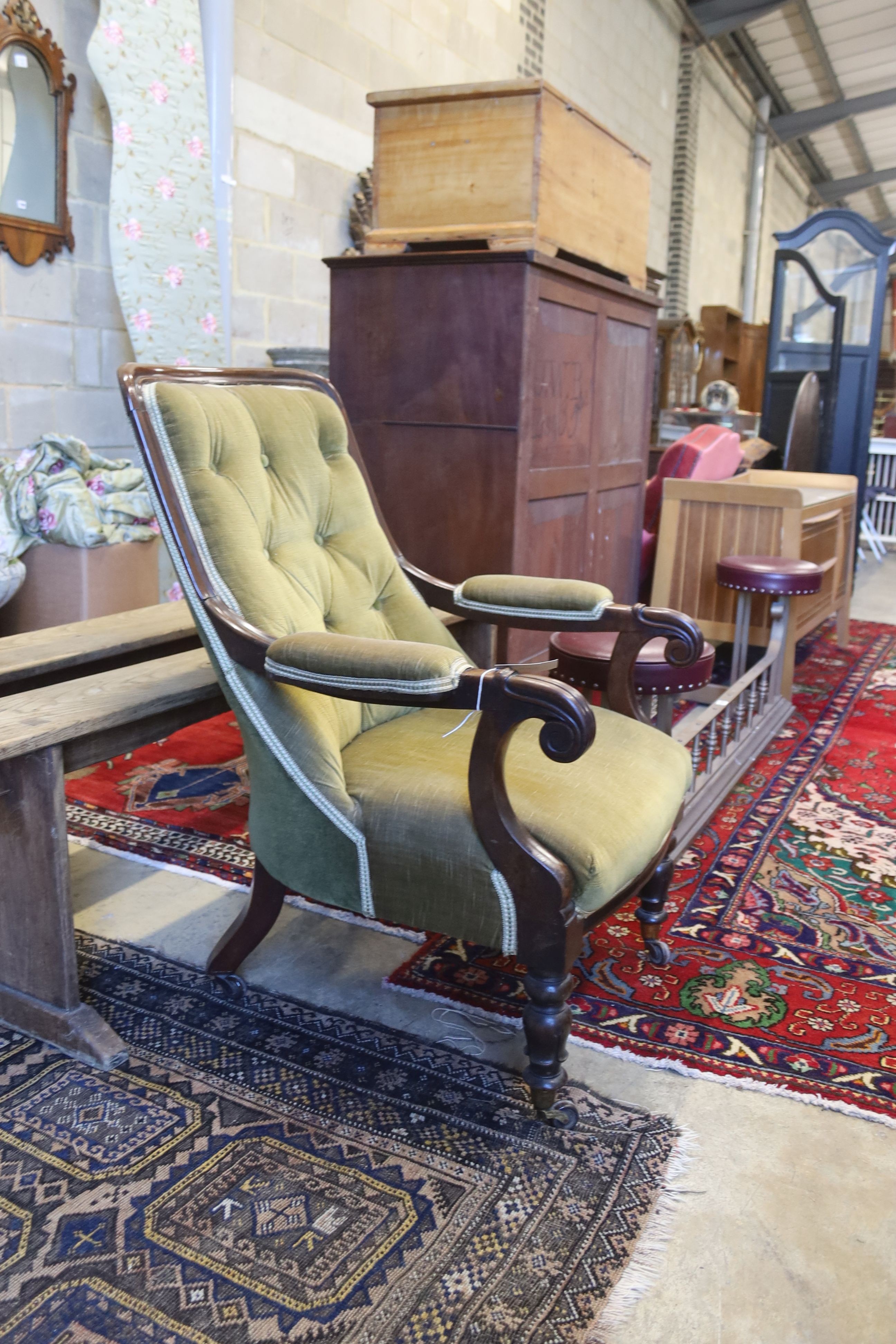 A Victorian mahogany upholstered open armchair, width 65cm, depth 70cm, height 94cm